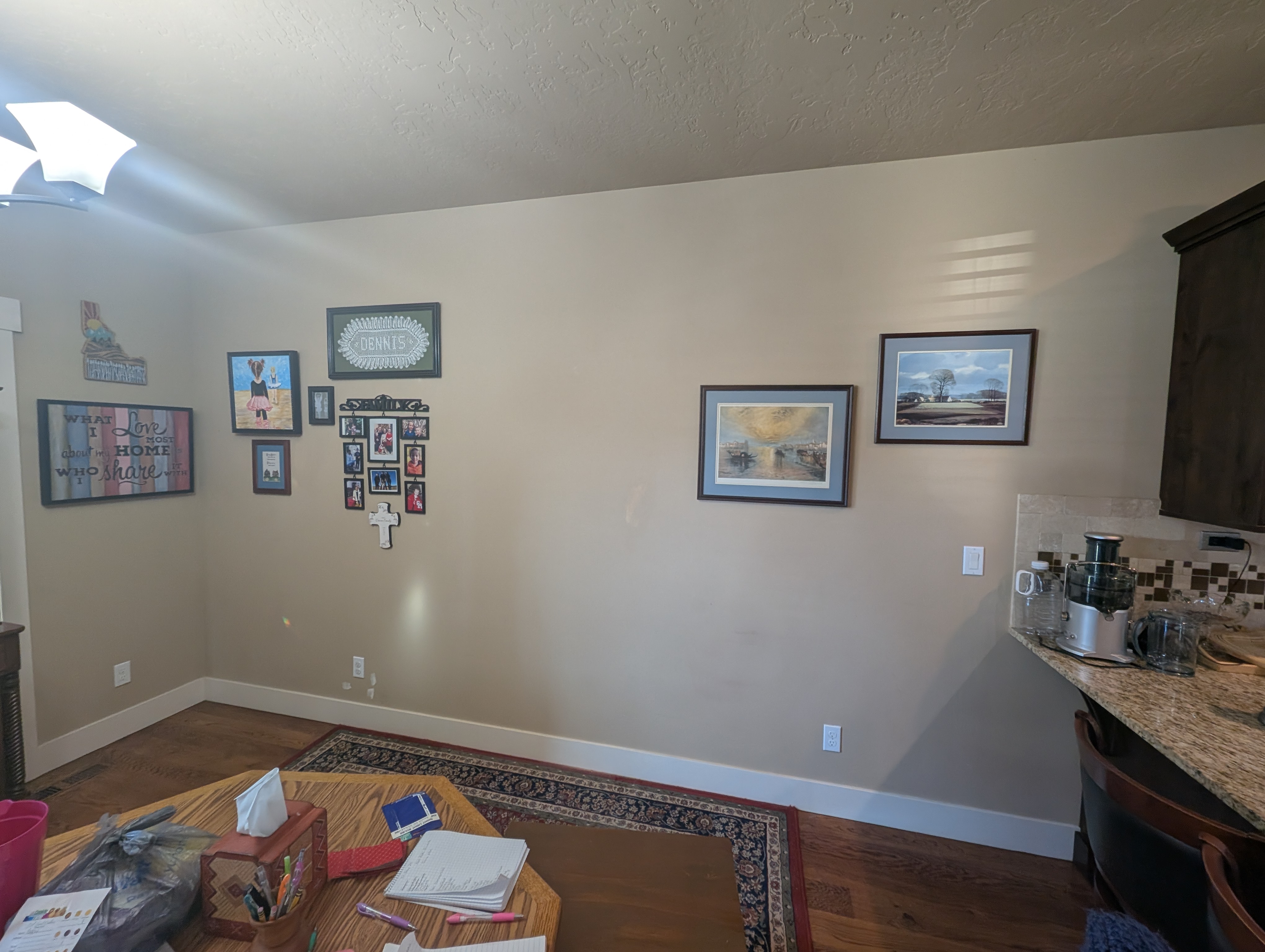 Dated dining and kitchen wall with beige paint before remodel